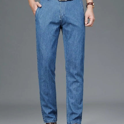 Men's straight leg jeans in blue denim with slight stretch, featuring pockets and a classic fit.