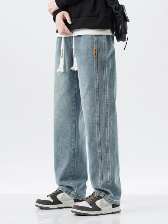 Men's full size washed loose fit wide leg jeans with drawstring and slight stretch in 100% cotton
