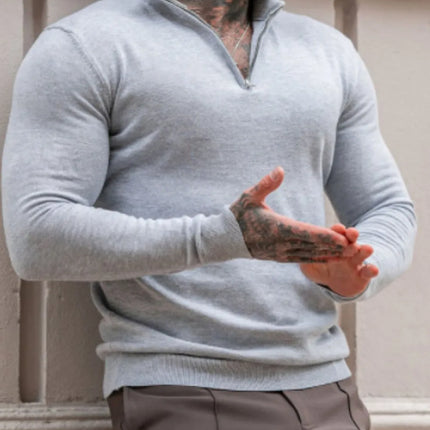 Men's plus size quarter zip long sleeve stretchy sweater in light gray with a basic style, worn by a tattooed man.