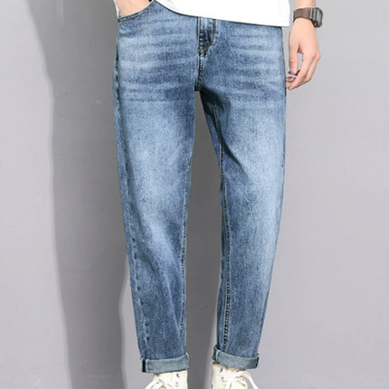 Men's washed straight leg jeans with cat's whisker detailing and slight stretch, made from cotton blend fabric.